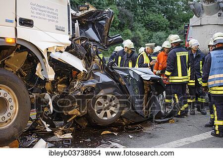 "Accident scene, massive traffic accident on the A8 motorway where a truck crushed a car, leaving two dead, near Kirchheim Teck, Baden-Wurttemberg, Germany, Europe" View Large Photo Image Picture - "Accident scene, massive traffic accident on the A8 motorway where a truck crushed a car, leaving two dead, near Kirchheim Teck, Baden-Wurttemberg, Germany, Europe". Fotosearch