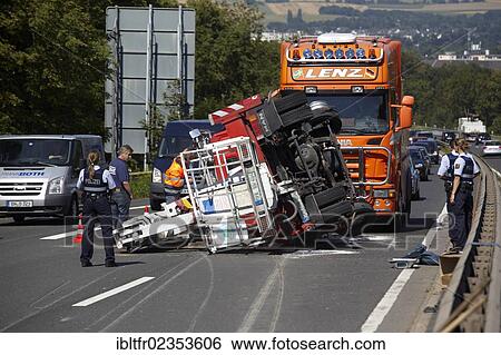 Stock Photograph - "Accident with a mobile elevating working platform, on the B9 road near Weissenthurm, Rhineland-Palatinate, Germany, Europe". Fotosearch