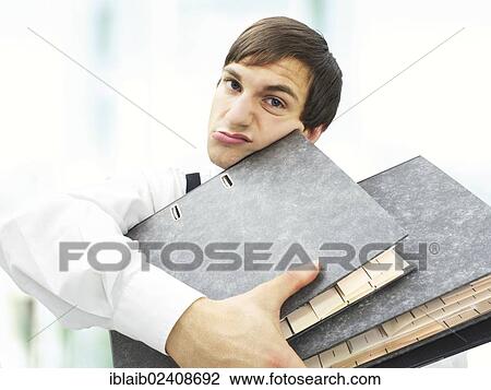 "Accountant, clerk at the office, carrying a pile of documents" View Large Photo Image Stock Image - "Accountant, clerk at the office, carrying a pile of documents". Fotosearch