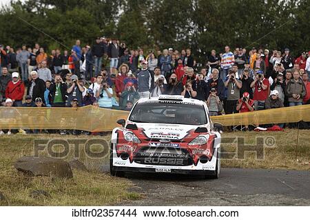 Picture - "ADAC Rally Deutschland, special stage, Baumholder military training area, Evgeny Novikov, RUS, and co-driver Nicolas Klinger, FRA, on Ford, Baumholder, Rhineland-Palatinate, Germany, Europe". Fotosearch