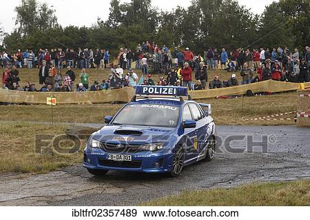 Stock Photo - "ADAC Rally Deutschland, special stage, Baumholder military training area, a Subaru police car of Baumholder police is the leading vehicle, Baumholder, Rhineland-Palatinate, Germany, Europe". Fotosearch