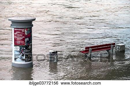 "Advertising column and a bench in the flood waters of the Danube River, near Ulm, Baden-Wurttemberg, Germany, Europe" View Large Photo Image Stock Photograph - "Advertising column and a bench in the flood waters of the Danube River, near Ulm, Baden-Wurttemberg, Germany, Europe". Fotosearch