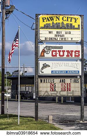 Picture - "Advertising signs, gun shop and pawn shop with American flag, Georgia, United States, North America". Fotosearch