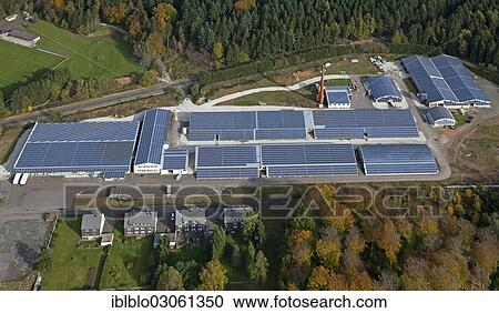"Aerial view, a factory with solar panels on the roof, Grafenwald industrial park, Hunsrueckhoehenstrasse scenic road, Im Adrian, Hermeskeil, Rhineland-Palatinate, Germany, Europe" View Large Photo Image Stock Image - "Aerial view, a factory with solar panels on the roof, Grafenwald industrial park, Hunsrueckhoehenstrasse scenic road, Im Adrian, Hermeskeil, Rhineland-Palatinate, Germany, Europe". Fotosearch