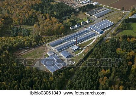"Aerial view, a factory with solar panels on the roof, Grafenwald industrial park, Hunsrueckhoehenstrasse scenic road, Im Adrian, Hermeskeil, Rhineland-Palatinate, Germany, Europe" View Large Photo Image Stock Photo - "Aerial view, a factory with solar panels on the roof, Grafenwald industrial park, Hunsrueckhoehenstrasse scenic road, Im Adrian, Hermeskeil, Rhineland-Palatinate, Germany, Europe". Fotosearch