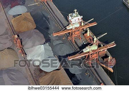 Picture - "Aerial view, a ship of the Russian Far Eastern Shipping Company is unloading Russian ore, Hamburger Hansaport, Hamburg, Hamburg, Germany, Europe". Fotosearch