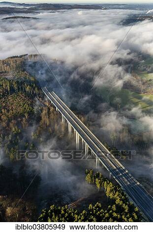 Stock Photo - "Aerial view, A46 motorway bridge, low clouds, Meschede, Sauerland, North Rhine-Westphalia, Germany, Europe". Fotosearch
