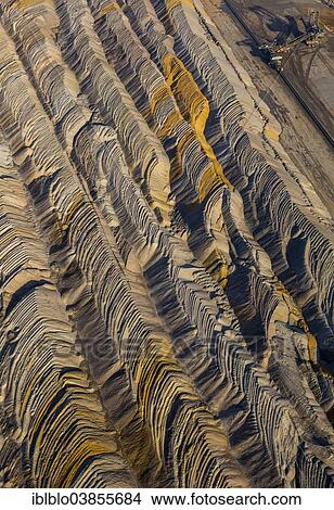 Picture - "Aerial view, an open cast mine excavator in the Hambach open pit mine, earth fills, Niederzier, Julich-Zulpicher Borde region, North Rhine-Westphalia, Germany, Europe". Fotosearch