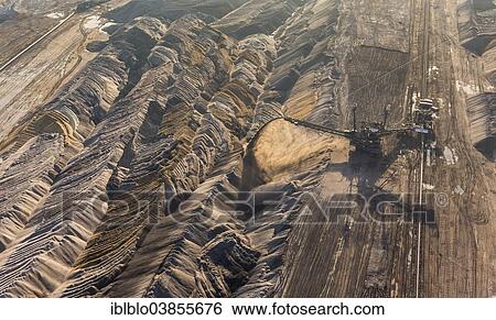 "Aerial view, an open cast mine excavator in the Hambach open pit mine, earth fills, Niederzier, Julich-Zulpicher Borde region, North Rhine-Westphalia, Germany, Europe" View Large Photo Image Stock Photograph - "Aerial view, an open cast mine excavator in the Hambach open pit mine, earth fills, Niederzier, Julich-Zulpicher Borde region, North Rhine-Westphalia, Germany, Europe". Fotosearch