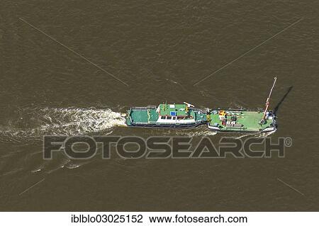 "Aerial view, """"Bitter"""" ferry on the Elbe River pushing the """"Herrenhaus"""" lighter, Hitzacker, Landkreis Luchow-Dannenberg, Lower Saxony, Germany, Europe" View Large Photo Image Stock Image - "Aerial view, """"Bitter"""" ferry on the Elbe River pushing the """"Herrenhaus"""" lighter, Hitzacker, Landkreis Luchow-Dannenberg, Lower Saxony, Germany, Europe". Fotosearch