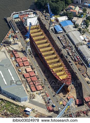 "Aerial view, Blohm & Voss dock, dry dock, hull, steel hull, Hamburg-Port, Hamburg, Hamburg, Germany, Europe" View Large Photo Image Stock Photo - "Aerial view, Blohm & Voss dock, dry dock, hull, steel hull, Hamburg-Port, Hamburg, Hamburg, Germany, Europe". Fotosearch