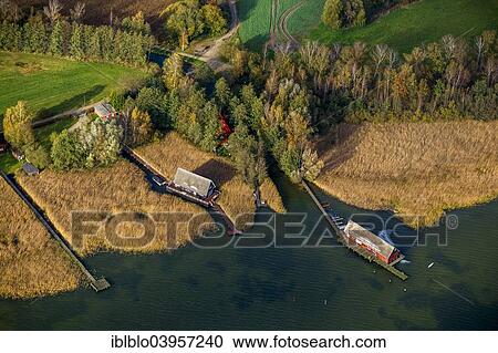 Stock Image - "Aerial view, boat houses on Inselsee Lake, Gustrow, Muritz lakeland, Mecklenburg Lake District, Mecklenburg-Western Pomerania, Germany, Europe". Fotosearch