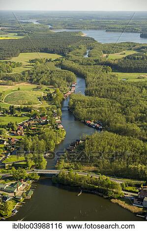 "Aerial view, boat houses on Mirower See Lake and canal to Zotzensee Lake, Mirow, Mecklenburg Lake District, Mecklenburg-Western Pomerania, Germany, Europe" View Large Photo Image Stock Photograph - "Aerial view, boat houses on Mirower See Lake and canal to Zotzensee Lake, Mirow, Mecklenburg Lake District, Mecklenburg-Western Pomerania, Germany, Europe". Fotosearch