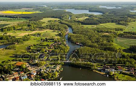 "Aerial view, boat houses on Mirower See Lake and canal to Zotzensee Lake, Mirow, Mecklenburg Lake District, Mecklenburg-Western Pomerania, Germany, Europe" View Large Photo Image Stock Photography - "Aerial view, boat houses on Mirower See Lake and canal to Zotzensee Lake, Mirow, Mecklenburg Lake District, Mecklenburg-Western Pomerania, Germany, Europe". Fotosearch