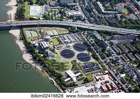 Stock Photo - Aerial view, Bonn, motorway bridge, Friedrich-Ebert-Bruecke bridge, A565 motorway, Rhine river, a sewage treatment plant and a swimming pool, Rhineland region, North Rhine-Westphalia, Germany, Europe. Fotosearch