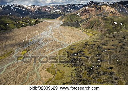 "Aerial view, Brennisteinsalda Volcano and Laugahraun Lava Field, Joekulgilkvisl braided river, rhyolite mountains partially covered with snow, Landmannalaugar, Fjallabak conservation area, Icelandic Highlands, Iceland, Europe" View Large Photo Image Stock Photo - "Aerial view, Brennisteinsalda Volcano and Laugahraun Lava Field, Joekulgilkvisl braided river, rhyolite mountains partially covered with snow, Landmannalaugar, Fjallabak conservation area, Icelandic Highlands, Iceland, Europe". Fotosearch