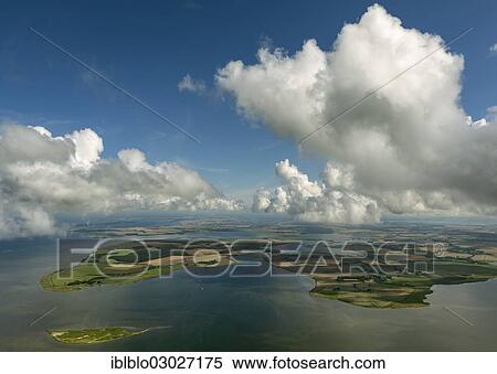 "Aerial view, clouds, view towards Ummanz across the islands of Heuwiese und Freesenort, Lieschow, Ummanz, Mecklenburg-Western Pomerania, Germany, Europe" View Large Photo Image Stock Photography - "Aerial view, clouds, view towards Ummanz across the islands of Heuwiese und Freesenort, Lieschow, Ummanz, Mecklenburg-Western Pomerania, Germany, Europe". Fotosearch