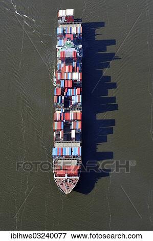 "Aerial view, container ship on the Elbe River, with long shadows of the stacked containers, Hamburg, Hamburg, Germany, Europe" View Large Photo Image Stock Photo - "Aerial view, container ship on the Elbe River, with long shadows of the stacked containers, Hamburg, Hamburg, Germany, Europe". Fotosearch