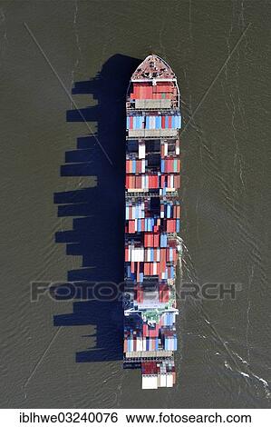 "Aerial view, container ship on the Elbe River, with long shadows of the stacked containers, Hamburg, Hamburg, Germany, Europe" View Large Photo Image Stock Photograph - "Aerial view, container ship on the Elbe River, with long shadows of the stacked containers, Hamburg, Hamburg, Germany, Europe". Fotosearch