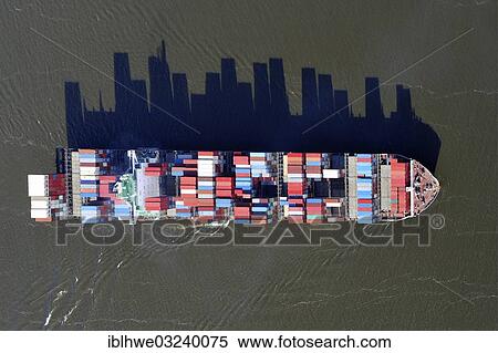 "Aerial view, container ship on the Elbe River, with long shadows of the stacked containers, Hamburg, Hamburg, Germany, Europe" View Large Photo Image Stock Photography - "Aerial view, container ship on the Elbe River, with long shadows of the stacked containers, Hamburg, Hamburg, Germany, Europe". Fotosearch