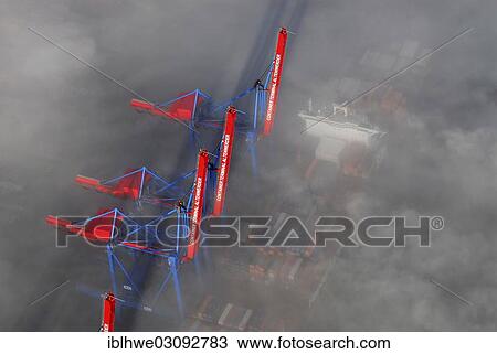 "Aerial view, container ships at the Container Terminal Altenwerder, CTA, in the fog, Hamburg, Hamburg, Germany, Europe" View Large Photo Image Stock Image - "Aerial view, container ships at the Container Terminal Altenwerder, CTA, in the fog, Hamburg, Hamburg, Germany, Europe". Fotosearch
