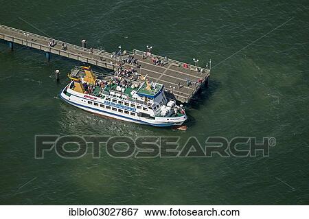 "Aerial view, cruise ship and wharf in Binz on the island of Ruegen, Ostseebad, Binz, Mecklenburg-Western Pomerania, Germany, Europe" View Large Photo Image Stock Photo - "Aerial view, cruise ship and wharf in Binz on the island of Ruegen, Ostseebad, Binz, Mecklenburg-Western Pomerania, Germany, Europe". Fotosearch