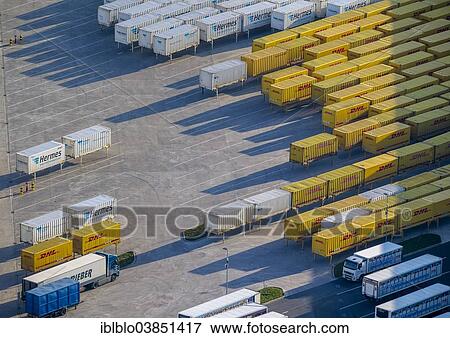 Stock Photo - "Aerial view, DHL and Hermes containers in the port of Hamm, North Rhine-Westphalia, Germany, Europe". Fotosearch