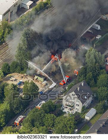 "Aerial view, fire and heavy smoke, An der Kohlenbahn street, Hagen, Sauerland region, North Rhine-Westphalia, Germany, Europe" View Large Photo Image Stock Image - "Aerial view, fire and heavy smoke, An der Kohlenbahn street, Hagen, Sauerland region, North Rhine-Westphalia, Germany, Europe". Fotosearch