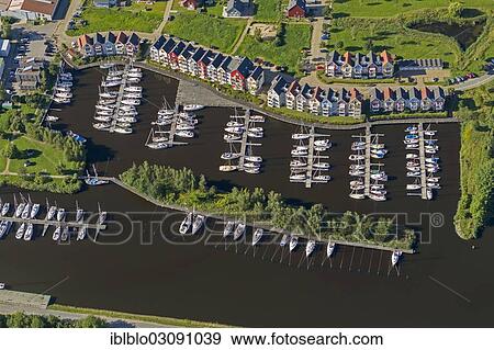"Aerial view, Greifswald marina on the Ryck River, colourful row of houses, Greifswald, Mecklenburg-Western Pomerania, Germany, Europe" View Large Photo Image Stock Photo - "Aerial view, Greifswald marina on the Ryck River, colourful row of houses, Greifswald, Mecklenburg-Western Pomerania, Germany, Europe". Fotosearch