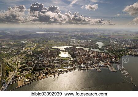 "Aerial view, harbour, marina with the German Oceanographic Museum and the Ozeaneum aquarium, old town island surrounded by water at the sound of Strelasund, Stralsund, Mecklenburg-Western Pomerania, Germany, Europe" View Large Photo Image Stock Photo - "Aerial view, harbour, marina with the German Oceanographic Museum and the Ozeaneum aquarium, old town island surrounded by water at the sound of Strelasund, Stralsund, Mecklenburg-Western Pomerania, Germany, Europe". Fotosearch