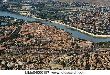 "Aerial view, historic centre of Arles on the Rhone River, city centre with the Arles Amphitheatre, UNESCO World Heritage Site, Arles, Provence-Alpes-Cote d'Azur, France, Europe" View Large Photo Image Stock Photo - "Aerial view, historic centre of Arles on the Rhone River, city centre with the Arles Amphitheatre, UNESCO World Heritage Site, Arles, Provence-Alpes-Cote d'Azur, France, Europe". Fotosearch