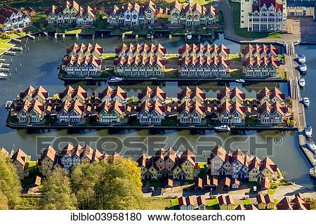 "Aerial view, holiday homes with moorings, Rheinsberg Marina, Rheinsberg Harbour Village, Maritim Hafenhotel Rheinsberg, Grosser Rheinsberger See Lake, Rheinsberg, Mecklenburg Lake District, Brandenburg, Germany, Europe" View Large Photo Image Stock Image - "Aerial view, holiday homes with moorings, Rheinsberg Marina, Rheinsberg Harbour Village, Maritim Hafenhotel Rheinsberg, Grosser Rheinsberger See Lake, Rheinsberg, Mecklenburg Lake District, Brandenburg, Germany, Europe". Fotosearch