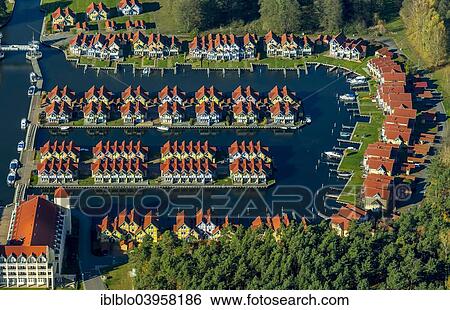 Stock Photograph - "Aerial view, holiday homes with moorings, Rheinsberg Marina, Rheinsberg Harbour Village, Maritim Hafenhotel Rheinsberg, Grosser Rheinsberger See Lake, Rheinsberg, Mecklenburg Lake District, Brandenburg, Germany, Europe". Fotosearch