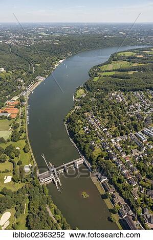 Stock Image - "Aerial view, Lake Baldeney, Werden district with weir, Essen, Ruhr Area, North Rhine-Westphalia, Germany, Europe". Fotosearch