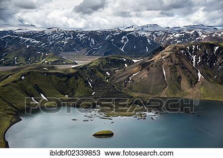 "Aerial view, Lake Frostastaoavatn with snow-covered rhyolite mountains, Namshraun lava field, Landmannalaugar, Fjallabak Conservation Area, Icelandic Highlands, Iceland, Europe" View Large Photo Image Stock Image - "Aerial view, Lake Frostastaoavatn with snow-covered rhyolite mountains, Namshraun lava field, Landmannalaugar, Fjallabak Conservation Area, Icelandic Highlands, Iceland, Europe". Fotosearch