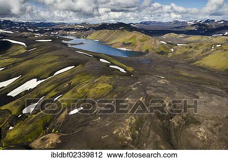 "Aerial view, Lake Skyggnisvatn, moss-covered landscape with snow-covered mountains, Icelandic Highlands, Iceland, Europe" View Large Photo Image Stock Image - "Aerial view, Lake Skyggnisvatn, moss-covered landscape with snow-covered mountains, Icelandic Highlands, Iceland, Europe". Fotosearch