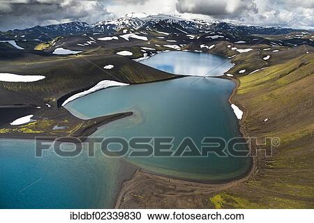 "Aerial view, Lake Skyggnisvatn, moss-covered landscape and snow-covered mountains, Icelandic Highlands, Iceland, Europe" View Large Photo Image Stock Image - "Aerial view, Lake Skyggnisvatn, moss-covered landscape and snow-covered mountains, Icelandic Highlands, Iceland, Europe". Fotosearch