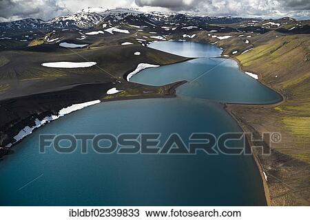 "Aerial view, Lake Skyggnisvatn, moss-covered landscape and snow-covered mountains, Icelandic Highlands, Iceland, Europe" View Large Photo Image Stock Image - "Aerial view, Lake Skyggnisvatn, moss-covered landscape and snow-covered mountains, Icelandic Highlands, Iceland, Europe". Fotosearch