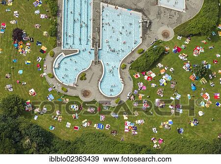 "Aerial view, lawn for sunbathing with the southern pool of the outdoor swimming centre, Herne, Ruhr Area, North Rhine-Westphalia, Germany, Europe" View Large Photo Image Stock Photo - "Aerial view, lawn for sunbathing with the southern pool of the outdoor swimming centre, Herne, Ruhr Area, North Rhine-Westphalia, Germany, Europe". Fotosearch