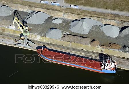 "Aerial view, loading of bulk onto coaster of the Otto A. Mueller shipping company, at Lehmannkai, Lubeck, Schleswig-Holstein, Germany, Europe" View Large Photo Image Stock Photograph - "Aerial view, loading of bulk onto coaster of the Otto A. Mueller shipping company, at Lehmannkai, Lubeck, Schleswig-Holstein, Germany, Europe". Fotosearch