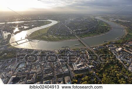 "Aerial view, loop of the Rhine river in front of Oberkassel, the historic district of Duesseldorf in the foreground, Rhineland region, North Rhine-Westphalia, Germany, Europe" View Large Photo Image Stock Image - "Aerial view, loop of the Rhine river in front of Oberkassel, the historic district of Duesseldorf in the foreground, Rhineland region, North Rhine-Westphalia, Germany, Europe". Fotosearch