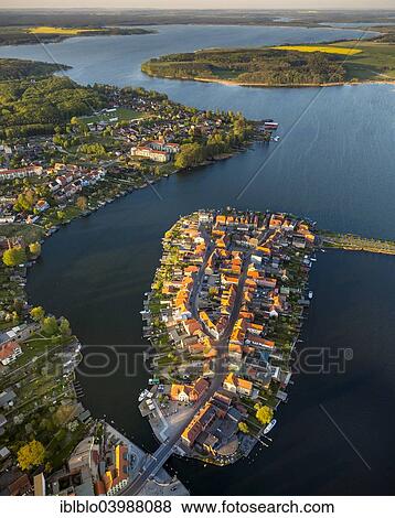 "Aerial view, Malchow with Malchower See lake and the island with the historic centre and its old market square, Malchow, Mecklenburg Lake District, Mecklenburg-Western Pomerania, Germany, Europe" View Large Photo Image Stock Photo - "Aerial view, Malchow with Malchower See lake and the island with the historic centre and its old market square, Malchow, Mecklenburg Lake District, Mecklenburg-Western Pomerania, Germany, Europe". Fotosearch