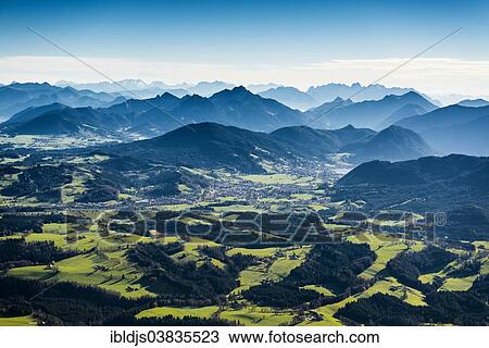 Stock Image - "Aerial view, meadows, forests and Alps, near Tegernsee, Upper Bavaria, Bavaria, Germany, Europe". Fotosearch