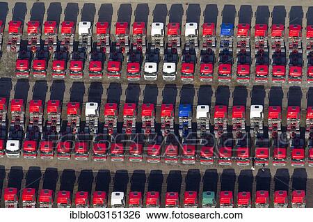 Stock Photograph - "Aerial view, Mercedes-Benz tractor units, new trucks in a car park, Hochlarmark, Recklinghausen, North Rhine-Westphalia, Germany, Europe". Fotosearch