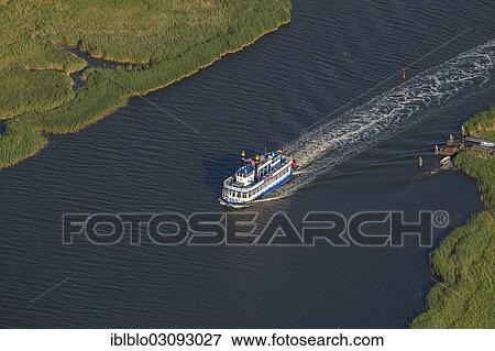Stock Photo - "Aerial view, Mississippi steamboat, riverboat near the Mueggenburg ferry dock, Grosser Kirr Island, Barther Bodden lagoon, Muggenburg, Zingst, Fischland-Darss-Zingst, Mecklenburg-Western Pomerania, Germany, Europe". Fotosearch
