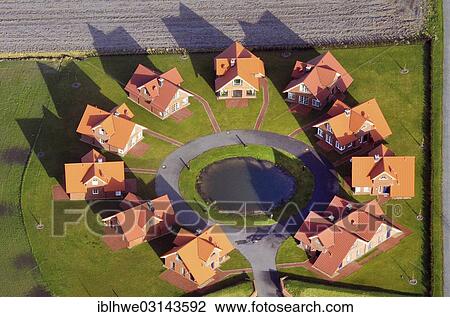 "Aerial view, modern rundling, a form of circular village with identical cottages, built in a circle, near Wilhelmshaven, Wilhelmshaven, Lower Saxony, Germany, Europe" View Large Photo Image Stock Image - "Aerial view, modern rundling, a form of circular village with identical cottages, built in a circle, near Wilhelmshaven, Wilhelmshaven, Lower Saxony, Germany, Europe". Fotosearch