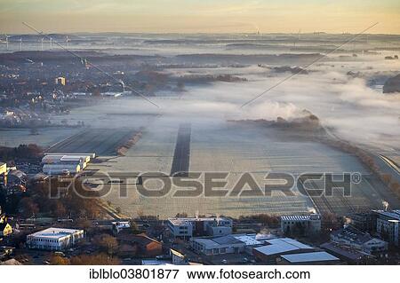 "Aerial view, morning fog, Flugplatz Hamm-Lippewiesen EDLH airfield, runway 06 24, Hamm-Heessen, Hamm, Ruhr area, North Rhine-Westphalia, Germany, Europe" View Large Photo Image Stock Photo - "Aerial view, morning fog, Flugplatz Hamm-Lippewiesen EDLH airfield, runway 06 24, Hamm-Heessen, Hamm, Ruhr area, North Rhine-Westphalia, Germany, Europe". Fotosearch