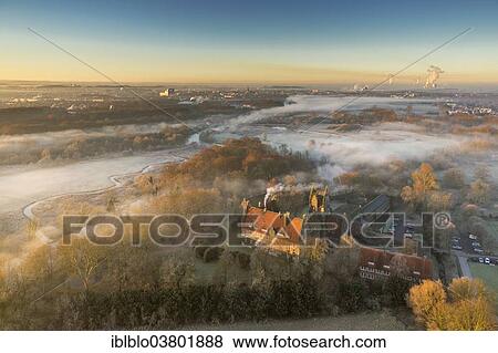 Stock Photo - "Aerial view, morning mist, Schloss Heessen castle boarding school, Hamm, Ruhr area, North Rhine-Westphalia, Germany, Europe". Fotosearch