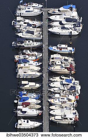 "Aerial view, motor boats at a jetty on the Dove-Elbe, an anabranch of the Unterelbe River, Hamburg, Hamburg, Germany, Europe" View Large Photo Image Stock Image - "Aerial view, motor boats at a jetty on the Dove-Elbe, an anabranch of the Unterelbe River, Hamburg, Hamburg, Germany, Europe". Fotosearch