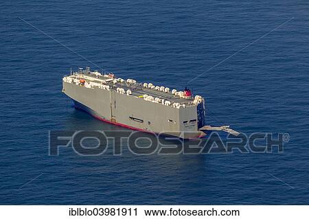 "Aerial view, """"Ocean Highway"""", vehicles carrier registered in Panama, at anchor, cargo ship, off Spiekeroog, North Sea, North Sea island, East Frisian Islands, Lower Saxony, Germany, Europe" View Large Photo Image Stock Image - "Aerial view, """"Ocean Highway"""", vehicles carrier registered in Panama, at anchor, cargo ship, off Spiekeroog, North Sea, North Sea island, East Frisian Islands, Lower Saxony, Germany, Europe". Fotosearch